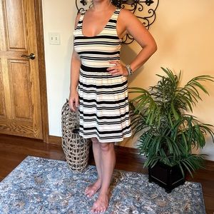 It’s J Crew black and white stripe dress with button detail.